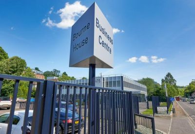 A modern 'Bourne House Business Centre' monument sign in front of the building entrance.