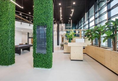 Lobby with vertical garden features and bright natural light.