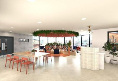 Spacious communal lounge with red chairs, hanging plants, and a reception desk.