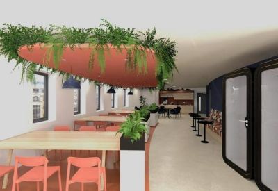 Collaborative workspace with wooden benches, orange chairs, and modern private call booths.