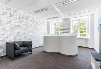 Reception area with modern sculpture-like wall art and seating.