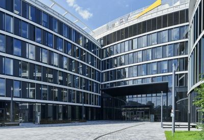 Modern stone-paved courtyard and main entrance area.