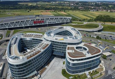 Aerial view of the unique three-lobed building architecture.