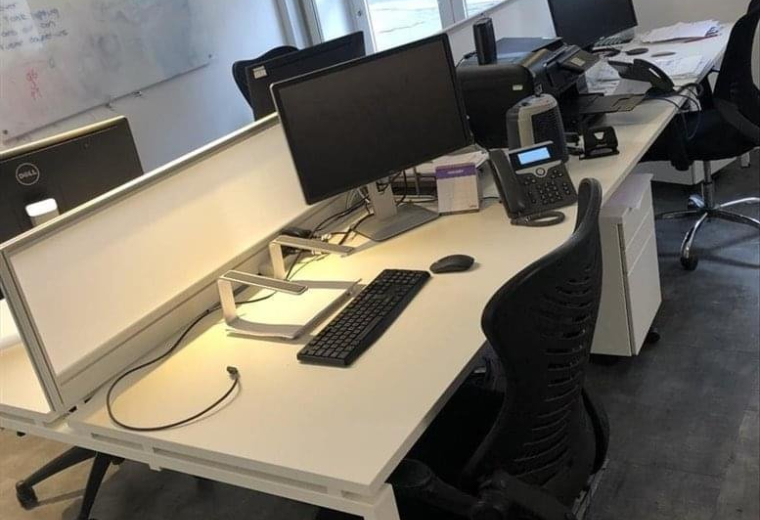 Bright workspace at St. George’s court, St. George’s road, Bristol with white desks and black ergonomic chairs.
