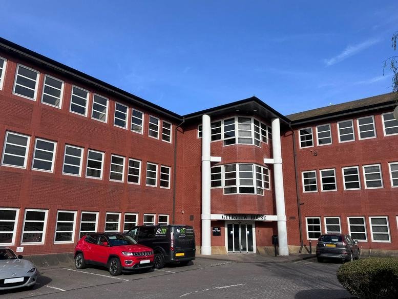 Exterior view of Gyleview House at 3, Redheughs Rigg with red brick facade and white pillars.
