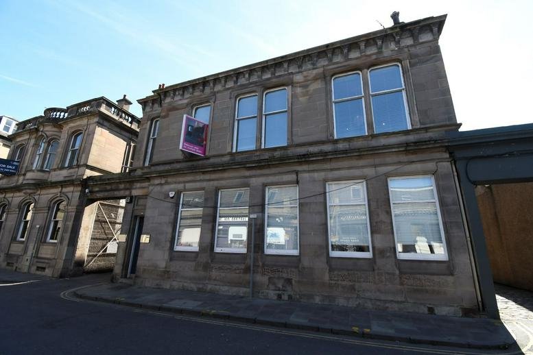 Exterior view of the historic stone facade at 93 Constitution Street, Leith, Edinburgh.