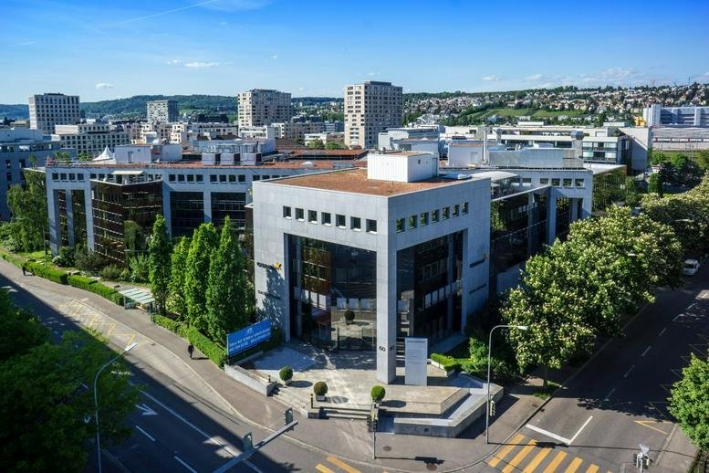 Exterior view of the multi-story commercial building at Baslerstrasse 60, Zurich.