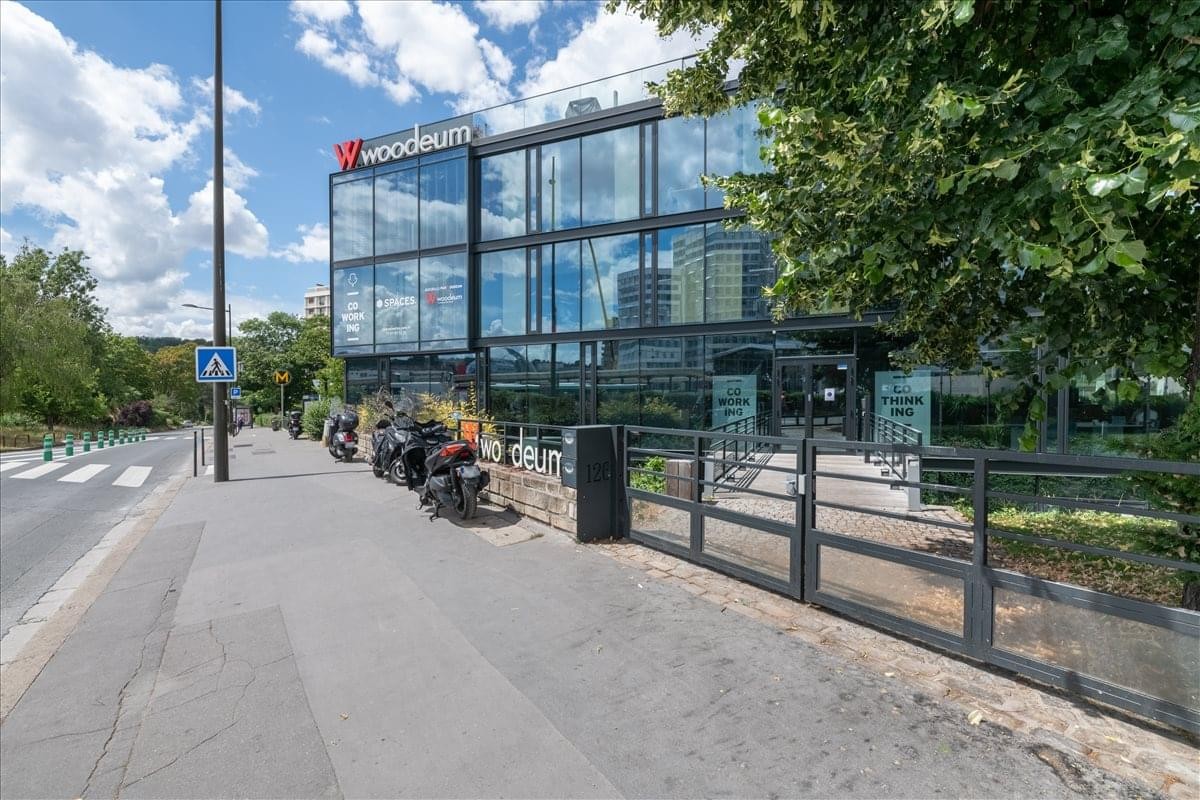 Modern glass-facade exterior of the 126 avenue du General Leclerc building.