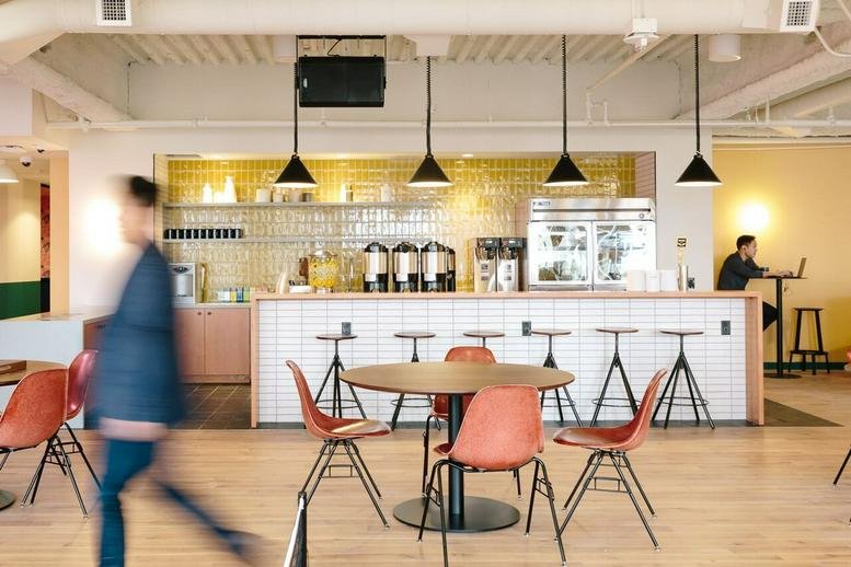 Spacious communal kitchen and cafe area at 198 Avenue de France, Paris.