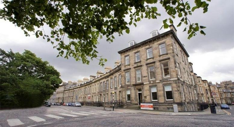 Exterior view of the historic stone townhouse building at 21 Lansdowne Crescent.