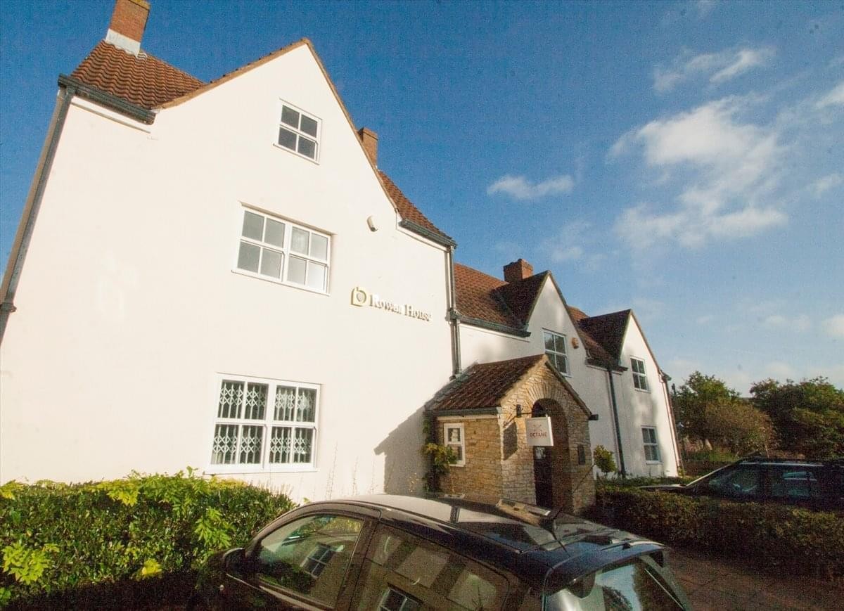 Exterior view of the historic white building at 6 Fernhill Court, Almondsbury.