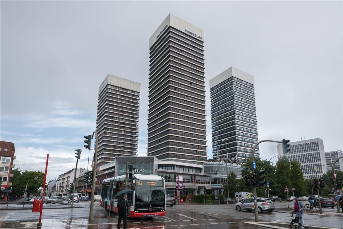 Exterior view of the three high-rise skyscrapers known as Mundsburg Tower in a city setting.