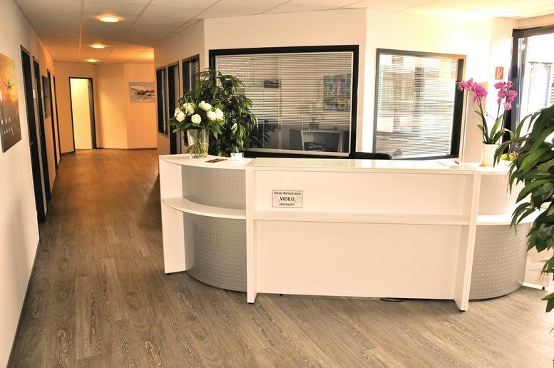 Bright, modern reception area at Obenhauptstrasse 7, 2nd Floor, Groß Borstel, Hamburg with white desk and wood flooring.