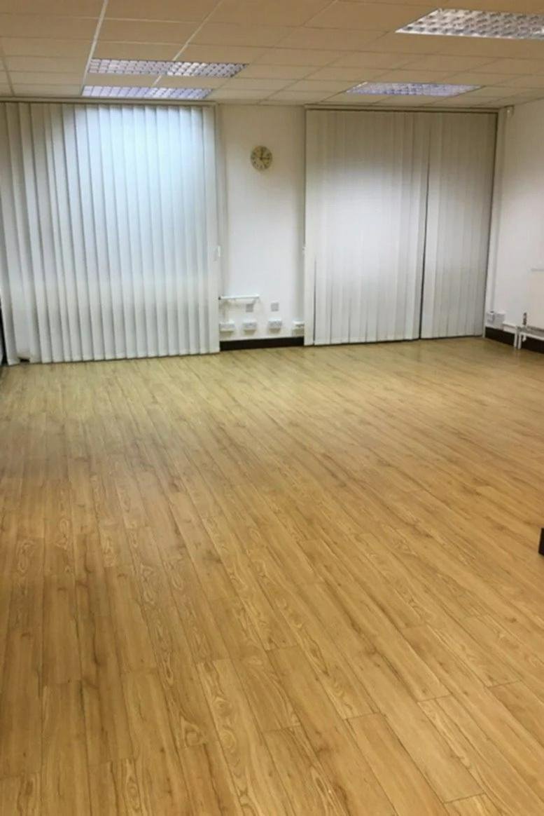 Spacious open-plan office with wood-effect flooring at Sunset House, 6 Bedford Park, Croydon.