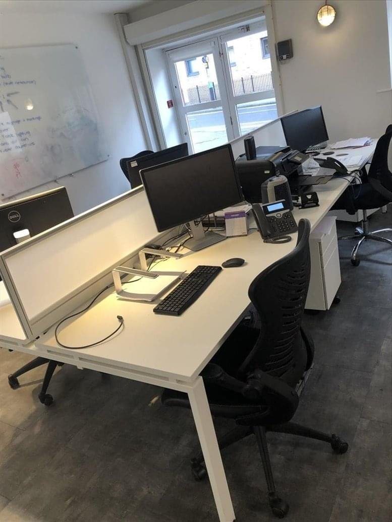 Bright workspace at St. George’s court, St. George’s road, Bristol with white desks and black ergonomic chairs.