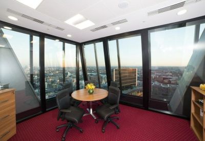 Private corner office suite with floor-to-ceiling windows overlooking the city.