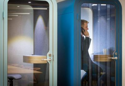 Two private blue and grey phone booths for confidential calls and quiet work.