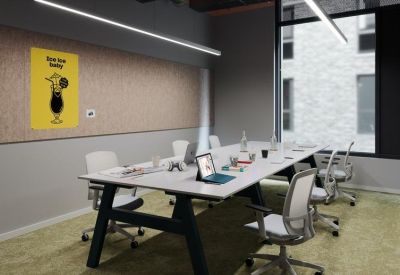 Modern meeting room with a long white table, ergonomic chairs, and a playful yellow wall graphic.