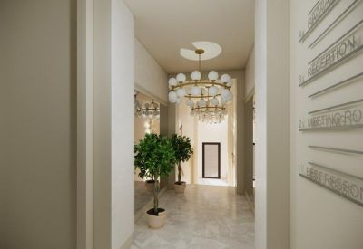 Modern hallway with marble floors and a tiered glass globe chandelier.