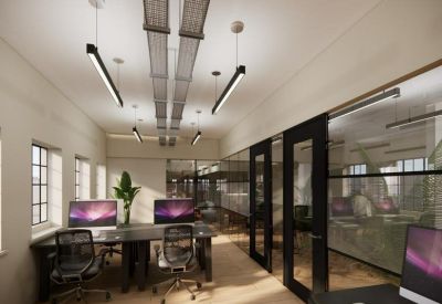 Modern office suite with black desks, private glass doors, and industrial ceiling tracks.