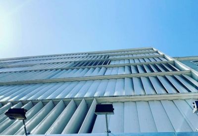 Exterior view of the modern facade at Av. Almirante Reis 65, Lisbon.