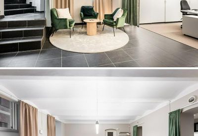 Open-plan office area with multiple desks and natural light