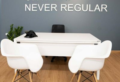 Private office at Zalokosta 8, Athens, Greece with a feature wall reading Be Bold or Italic Never Regular.