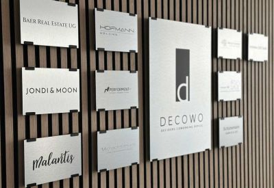 Company directory board on a modern wood-slatted feature wall.