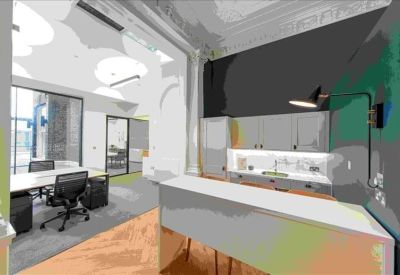Sleek office breakout area featuring a modern kitchen island and adjacent workspace with desk seating.