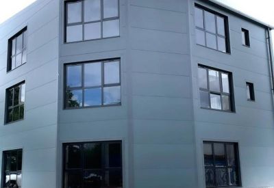 Modern grey industrial building exterior at 8 Lyon Way Industrial Estate.