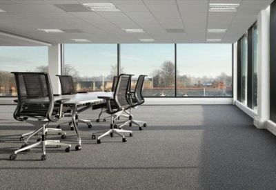 Spacious boardroom featuring a long white table and panoramic window views.