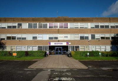 Exterior view of the brick facade and entrance at Moulton Park Business Centre, Northampton.