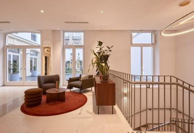 Small reception area with seating and circular rug