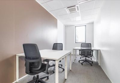 Private three-person office suite with white desks and a brown feature wall.