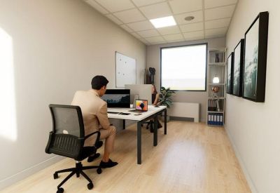 Private office space with two desks, ergonomic chairs, and large window.