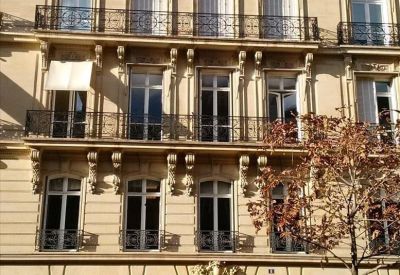 Exterior view of the ornate Haussmann-style stone building at 8 Avenue Hoche, Paris.