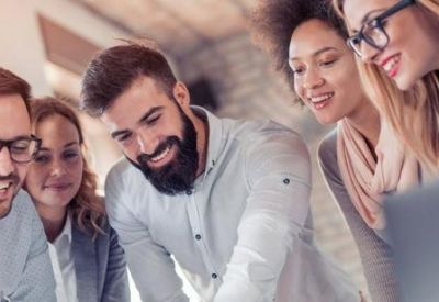 Group of people collaborating in a bright workspace.