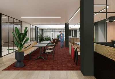 Dining area with communal seating and plants.