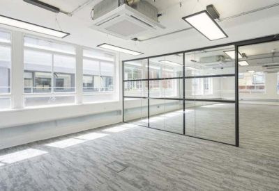 Meeting area with a sleek black-framed glass partition wall.