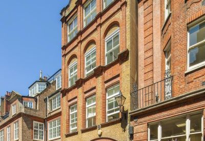 Grand brick exterior and arched entrance of 14 Old Queen Street, St. James's Park.
