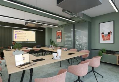 Large conference room with a U-shaped table, pink chairs, and olive green walls.