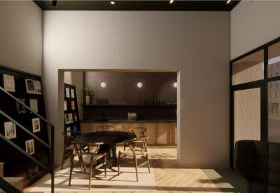 Modern interior view looking into a wooden-clad kitchen through a large wall opening.
