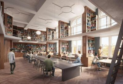 Grand library-style workspace with double-height bookshelves and long shared wooden tables.