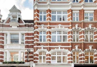 Exterior of 175 Wardour Street, a red-brick building with ornate white window frames.