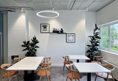 Four-person office space with large windows providing plenty of natural light.