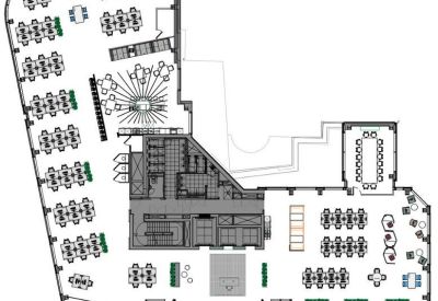 Detailed floor plan showing an open-plan office layout with multiple desk clusters.