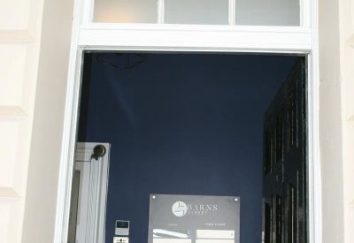 Reception entrance featuring a navy blue wall and directory signage.