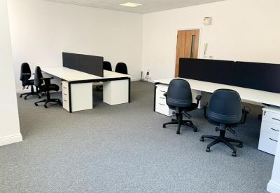 Spacious open-plan office with white desks, ergonomic chairs, and natural light at 31 Bootham.