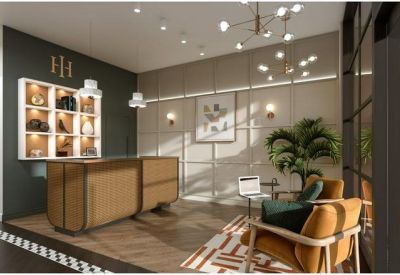 Bright reception area featuring a wood-paneled front desk and comfortable seating.