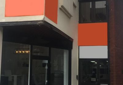 Exterior street view of the modern commercial entrance at 5-7 Kingston Hill.